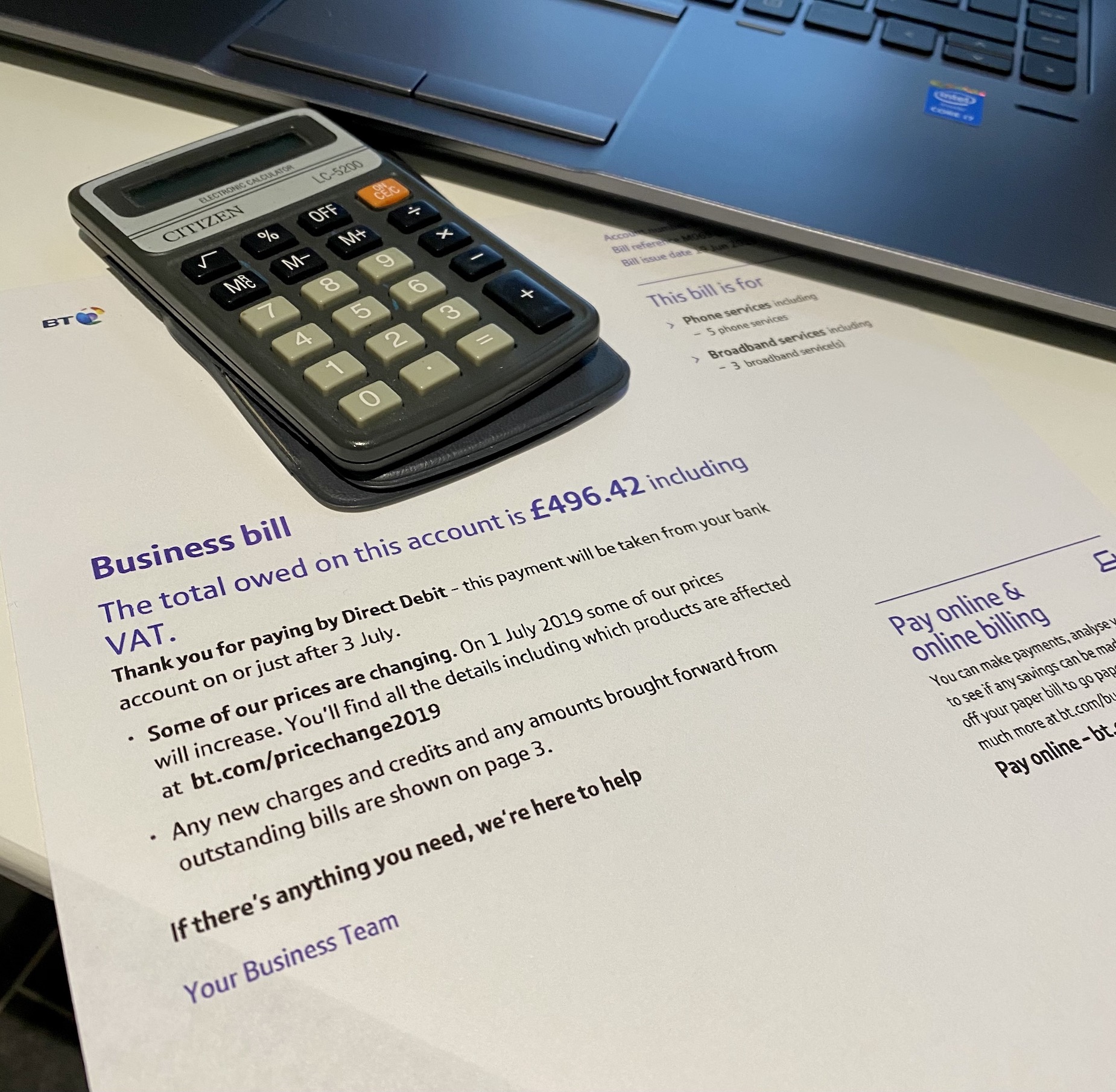 Copy of a business BT phone bill with a calculator